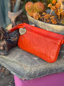 Hand tooled leather fanny pack from Chicana leather luxury designer in orange